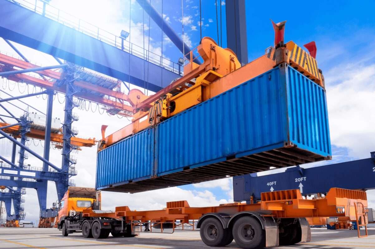 Realistic-image-of-a-container-being-lifted-from-a-truck-on-delivery-1